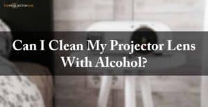 Can I clean my projector lens with alcohol